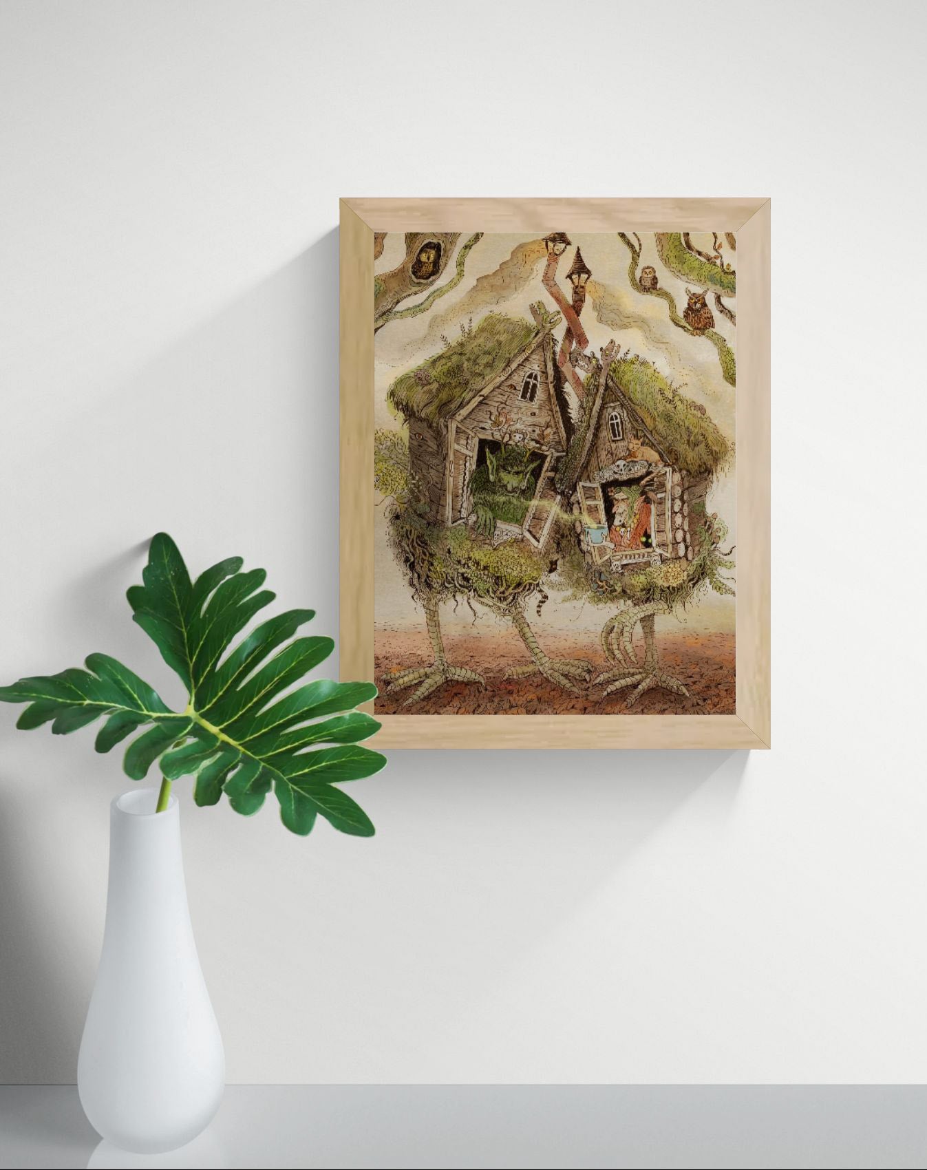 Whimsical folklore-inspired giclée art print featuring two walking woodland cottages on bird-like legs, magical creatures, owls, witches, and detailed forest elements in earthy tones. Vertical fantasy wall art for cozy home decor.