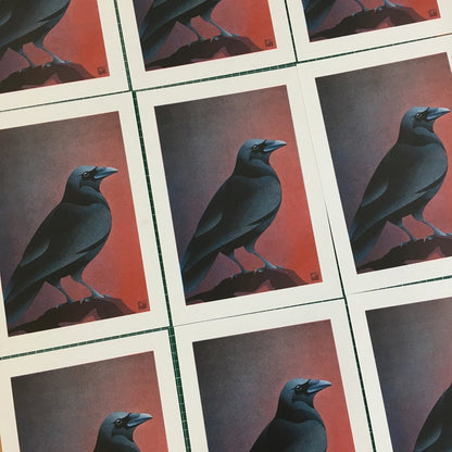 Atmospheric crow art print by Vrijformaat, featuring a sleek black crow against a moody gradient background of red and violet hues. A minimalist and elegant illustration perfect for modern interiors and bird lovers. Available at Galerie Frits