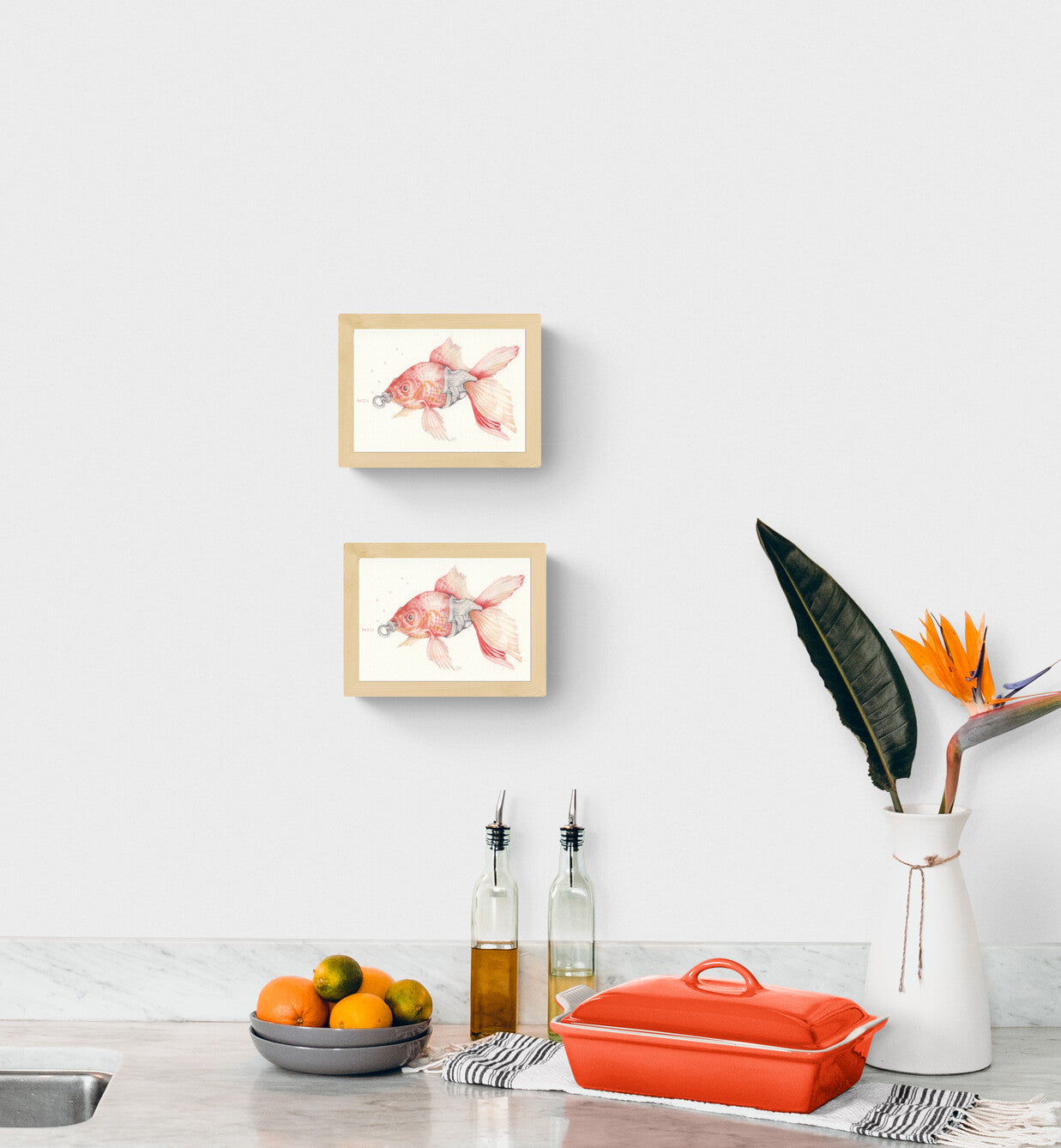 Delicate and whimsical illustration by FAB titled 'Baby Goldfish,' featuring a soft pink and orange goldfish with a pacifier in its mouth and the word 'hello' typed in red. Rendered in gentle pencil tones with a surreal twist, this charming and humorous artwork is perfect for nursery walls, quirky gift ideas, or fans of imaginative animal art