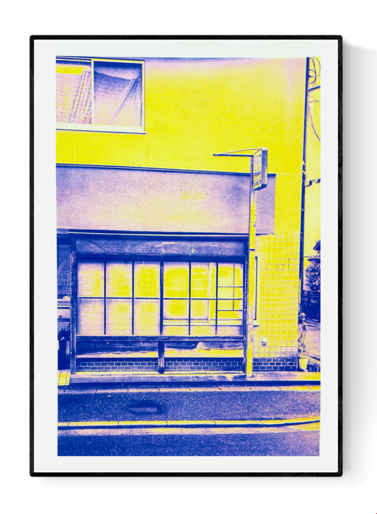 Limited edition A3 risograph print by PTRVRKD depicting a minimalist Kyoto house front in bold neon yellow and deep blue tones, Japanese architectural details, modern graphic style, contemporary wall art for home decor, perfect for Japan lovers and design enthusiasts.