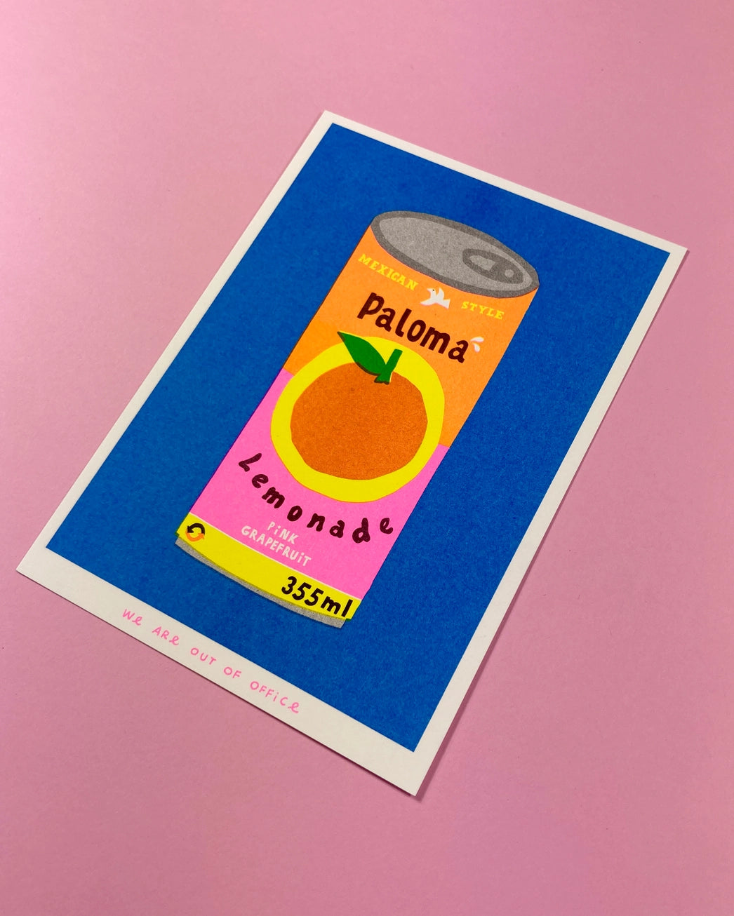 Colorful risograph print of a retro-style Paloma lemonade can with pink grapefruit label on blue background – Paloma Lemonade by We Are Out Of Office, 13 x 18 cm art print.