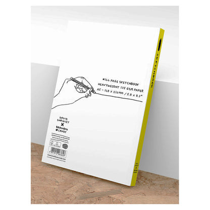 David Shrigley A5 sketchbook with bold white handwritten quote “My artwork is terrible and I am a very bad person” on black cover – perfect bound with 144 blank pages for drawing or sketching.