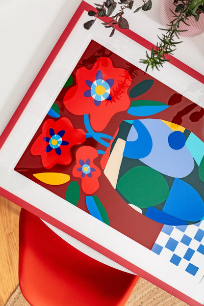 Burgundy on Check by Teresa Rego – colorful abstract floral art print with red flowers in a geometric vase on a checkered tablecloth, bold contemporary design perfect for modern home decor, available at Galerie Frits