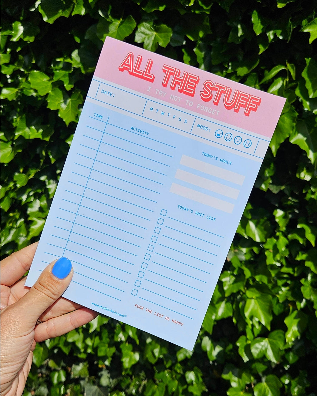 Funny and colorful A5 notepad with bold red and pink lettering, including to-do lists, goals, mood tracker and humorous sections like "Today’s Shit List" – designed by Dutch brand Studio Inktvis and printed in the Netherlands.