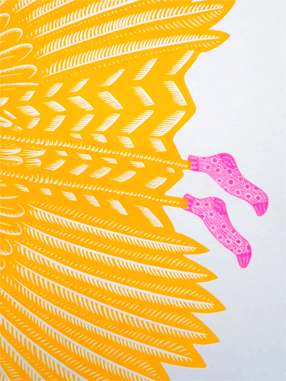 Vibrant risograph art print of a golden-yellow bird in flight wearing humorous pink polka-dot socks, titled Feelin’ Fly by Strangford, printed on recycled A3 paper in Northern Ireland.