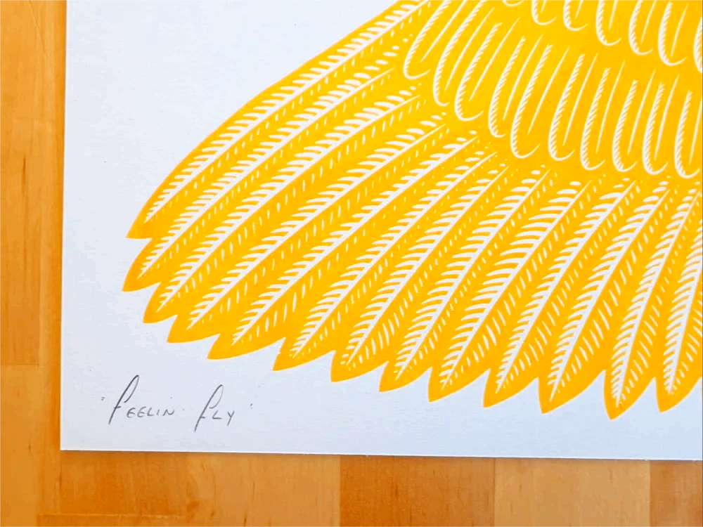 Vibrant risograph art print of a golden-yellow bird in flight wearing humorous pink polka-dot socks, titled Feelin’ Fly by Strangford, printed on recycled A3 paper in Northern Ireland.