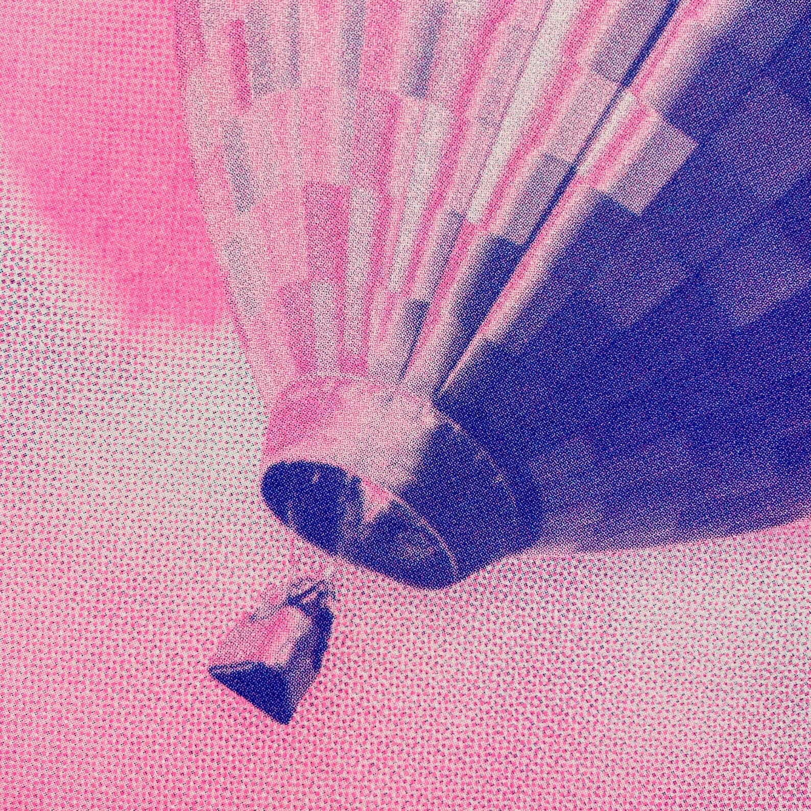 A3 risograph print of a pink and blue hot air balloon floating over dreamy clouds by PTRVRKD, hand-printed on 300 gsm Biotop paper.