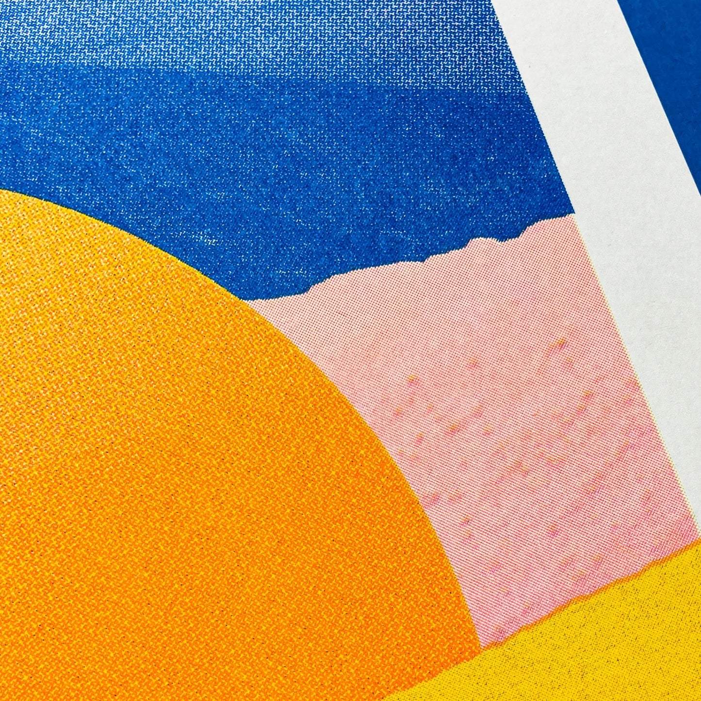 Minimalist desert art print with bold yellow sun and African dune landscape in vivid blue, orange, and peach tones by Dutch artist PTRVRKD – A3 risograph print, limited edition, eco-friendly ink.