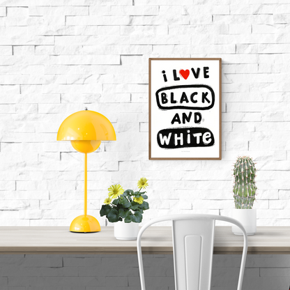 Minimal black and white typography art print with bold hand-painted letters reading “I love black and white,” featuring a red heart symbol and playful brush texture — perfect modern wall decor for minimalists and design lovers.