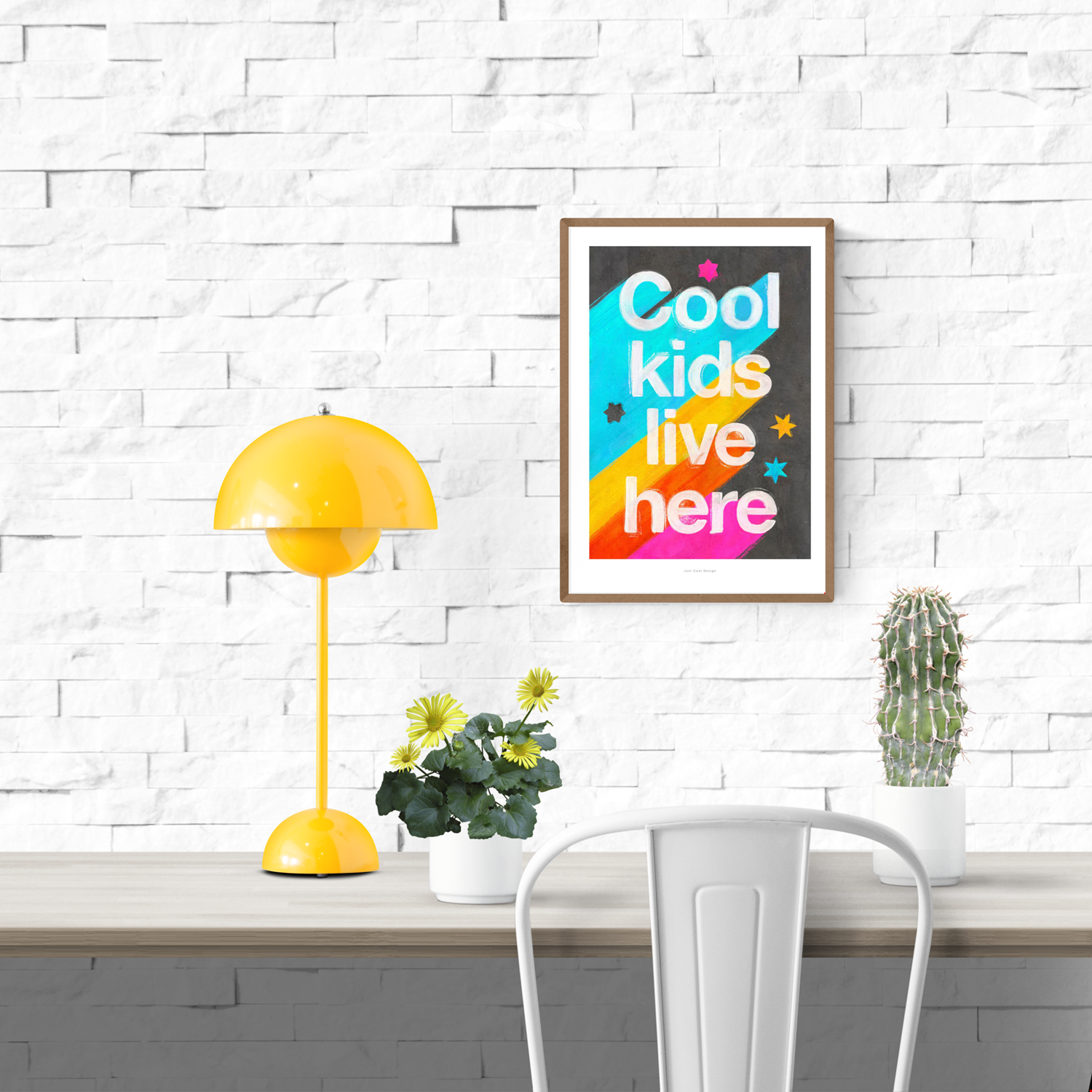 Giclée art print by Just Cool Design with the phrase "Cool kids live here" in bold white letters over a bright rainbow background with stars, ideal for colorful children's rooms or playful modern decor.
