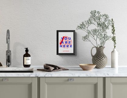 A6 hand-printed screen print titled “You Are Here” by De Zeverij, featuring a red and blue graphic map of Antwerp with bold typography, contemporary Belgian illustration art.