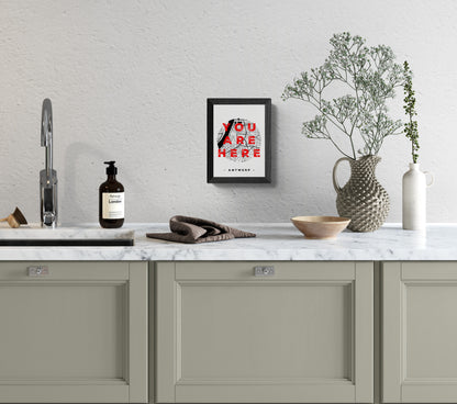 A6 hand-printed screen print titled “You Are Here” by De Zeverij, featuring a red and blue graphic map of Antwerp with bold typography, contemporary Belgian illustration art.