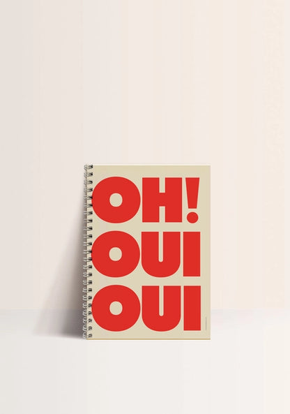 A5 spiral notebook titled “Oh! Oui Oui” by French brand Papier & Co., featuring bold red typography on a cream background, 60 blank pages, made with recycled paper – fun and eco-friendly stationery for creatives and design lovers.