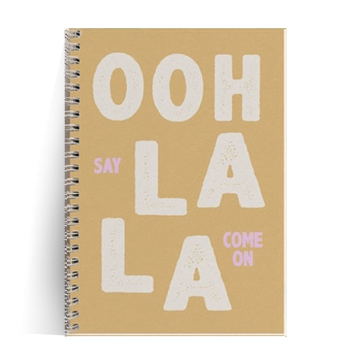 A5 spiral notebook titled “Ooh La La” by Papier & Co., featuring bold white typography on a warm brown cover with pastel pink accents, 60 blank recycled pages – French-designed eco-friendly notebook for creatives and design lovers.