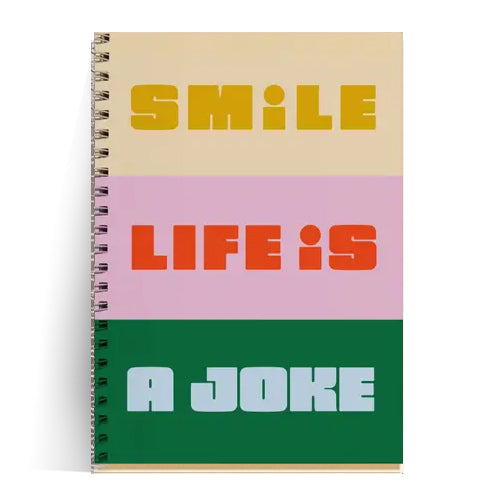 Colorful A5 spiral notebook with bold text "Smile, Life is a Joke" on recycled paper cover, featuring 60 blank pages of 80gsm paper, made in France – perfect for artists, students, and stationery lovers with attitude