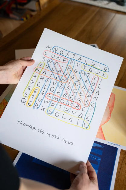 Risograph art print “Les mots doux” by Paul Lecat – colorful word search illustration featuring French words like “amour,” “soleil,” and “nostalgie” drawn in soft red, blue, and yellow lines on white background, poetic modern wall art in A3 format.