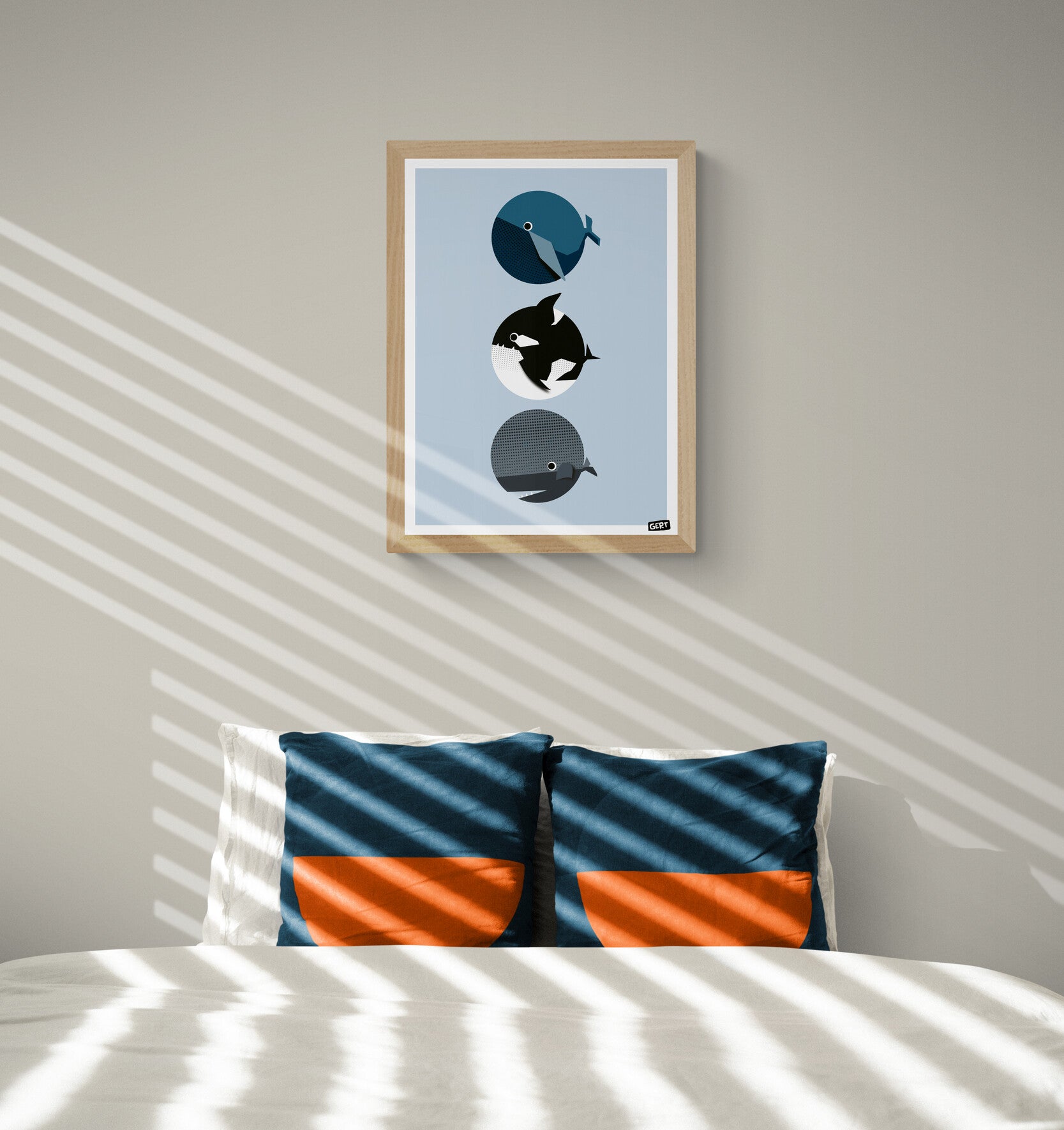 Whales by Gert Paenen, minimalist whale art print featuring three geometric whales in blue, black and grey tones on a soft blue background, contemporary marine life wall art for modern home decor.