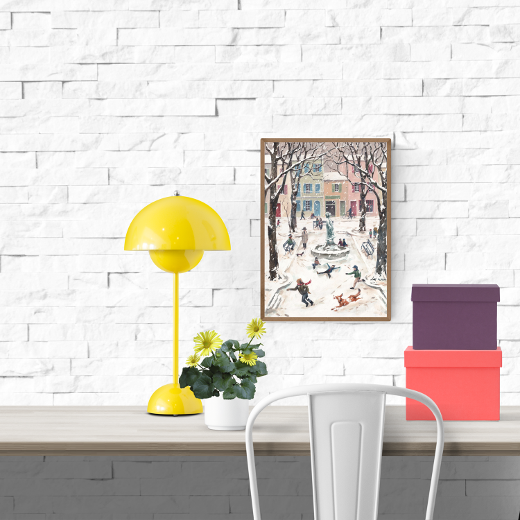 Winter scene illustration of a European village square filled with children and adults playing in the snow, a dog running, and pastel buildings in the background. A nostalgic, cozy winter print by Belgian illustrator Stien van Kerckhoven.