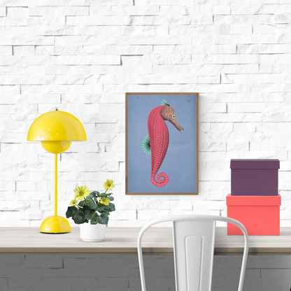 Whimsical art print of a stylized pink and brown seahorse named Stanley, designed by Studio Frits, with a coiled tail, mint green fins, and a newspaper-textured head on a soft blue background. Printed in Belgium on sturdy A4 paper—perfect for children’s rooms, coastal decor, or lovers of surreal marine illustrations.