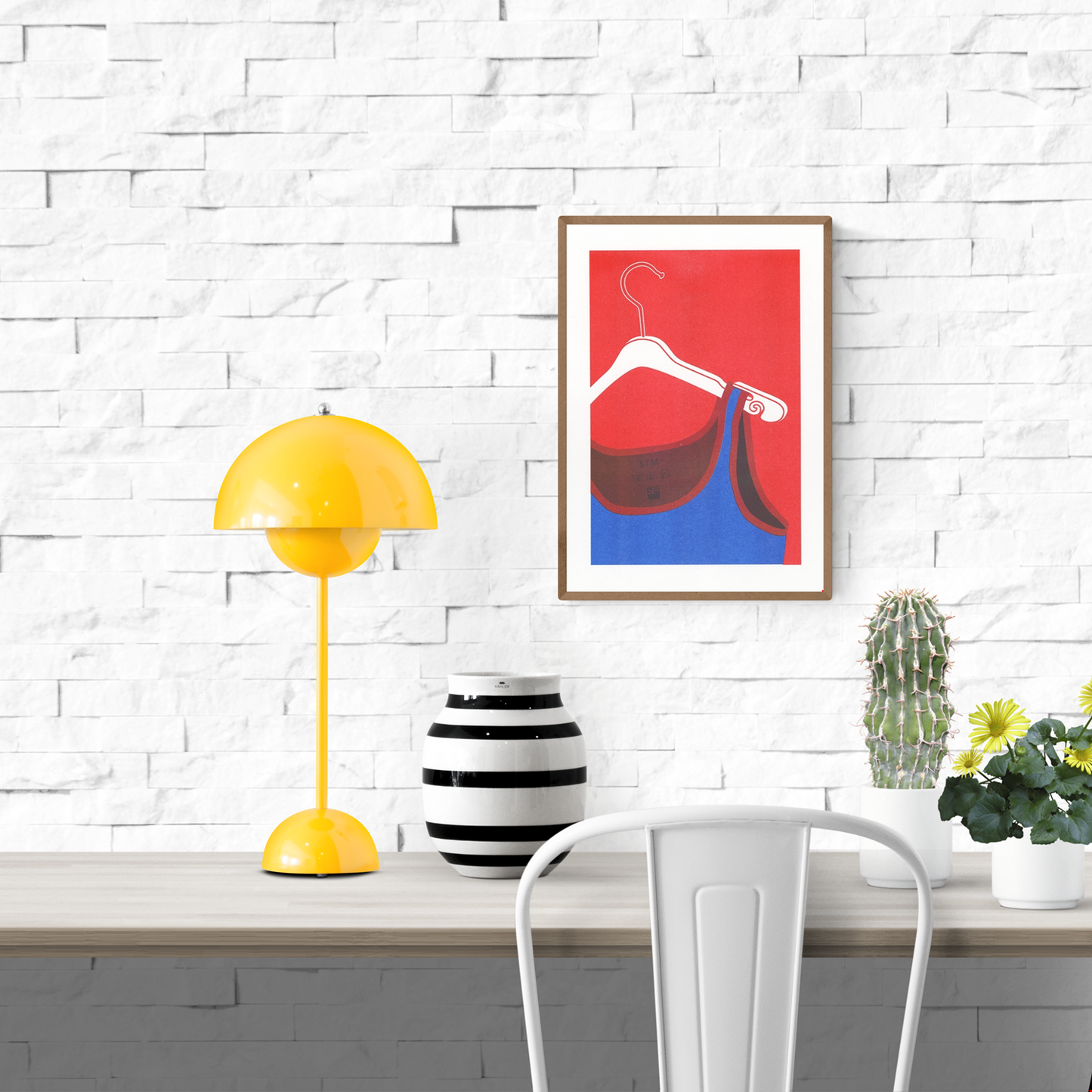 Risograph art print of a white coat hanger with a blue tank top by VrijFormaat. Minimalist red and blue composition celebrating everyday objects in bold graphic style. Perfect wall art for modern homes and design enthusiasts.