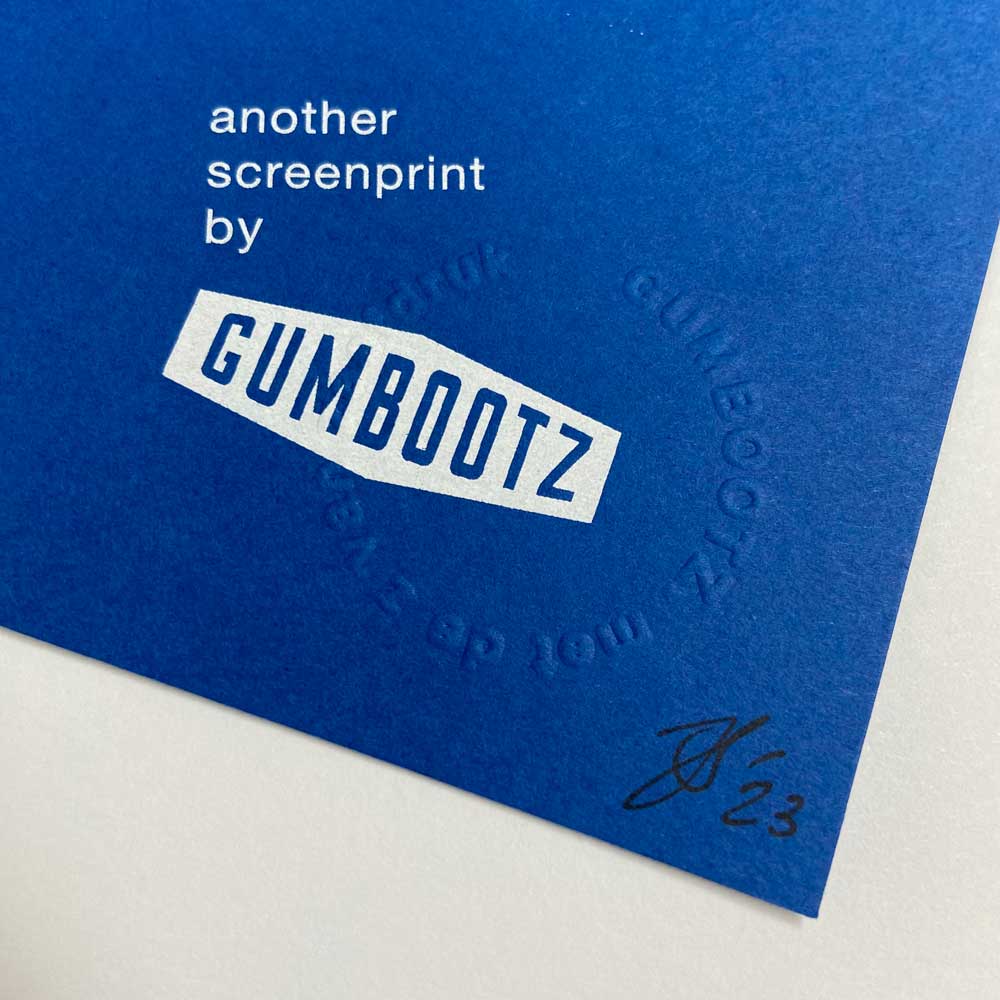 Large blue screen print with bold pink and white typography spelling 'Foxtrot Uniform Charlie Kilo India Tango' by Dutch artist Gumbootz — modern statement art poster, ideal for contemporary spaces.