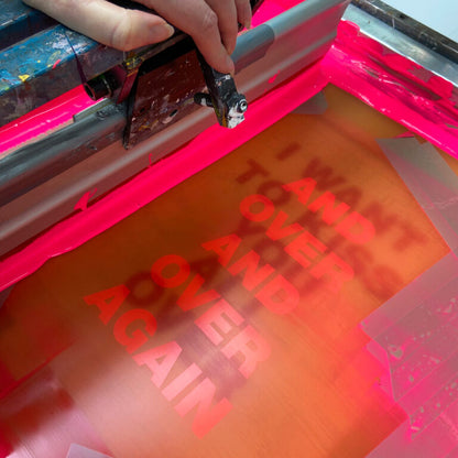 Typography art print ‘I Want to Kiss You All Over’ by Gumbootz, 30×40 cm hand-pulled screen print in bold red and fluorescent pink, modern graphic poster with overlapping text design, contemporary wall art for lovers of expressive, romantic prints.